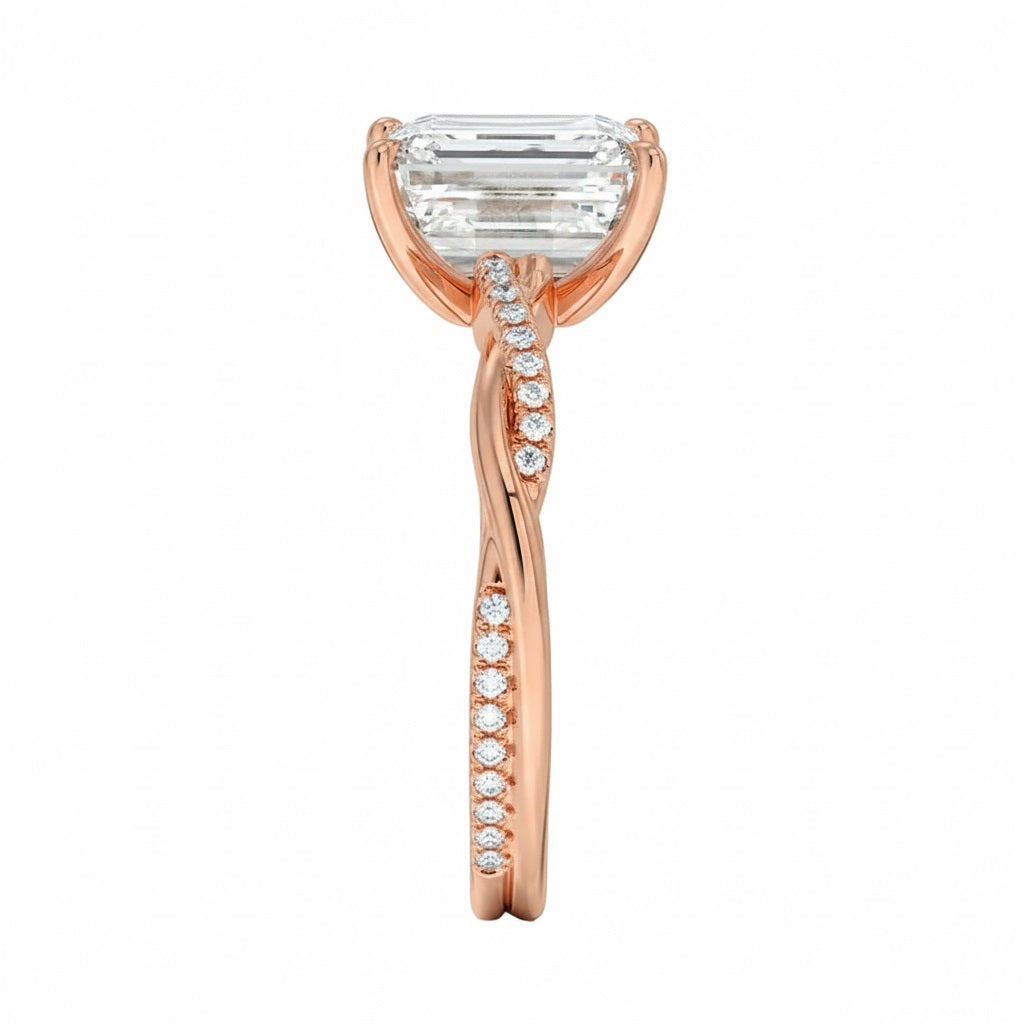 Emerald cut Moissanite lab grown diamond engagement ring with twisted single pave set gold shank, against a white background.Moissanite engagement ring cape town south africa grand diamonds ralph jacobs jeulia