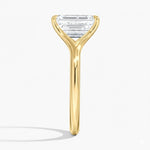 Emerald  cut Moissanite lab grown diamond engagement ring V-split band  with a four claw setting, on a gold band, against a white background.Moissanite engagement ring cape town south africa grand diamonds ralph jacobs jeulia  