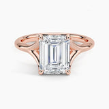 Emerald  cut Moissanite lab grown diamond engagement ring V-split band  with a four claw setting, on a gold band, against a white background.Moissanite engagement ring cape town south africa grand diamonds ralph jacobs jeulia  