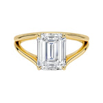 Emerald cut Moissanite lab grown diamond engagement ring round shank with a four claw setting, on a gold band, against a white background.Moissanite engagement ring cape town south africa grand diamonds ralph jacobs jeulia 