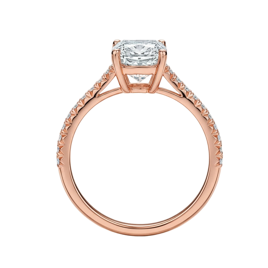 Emerald cut Moissanite lab grown diamond engagement ring pave set shank with a four claw setting, on a gold band, against a white background.Moissanite engagement ring cape town south africa grand diamonds ralph jacobs jeulia 