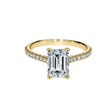 Emerald cut Moissanite lab grown diamond engagement ring pave set shank with a four claw setting, on a gold band, against a white background.Moissanite engagement ring cape town south africa grand diamonds ralph jacobs jeulia 