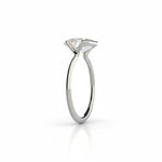 Emerald cut Moissanite lab grown diamond engagement ring column clean sophisticated design on a gold band, against a white background.Moissanite engagement ring cape town south africa grand diamonds ralph jacobs jeuli