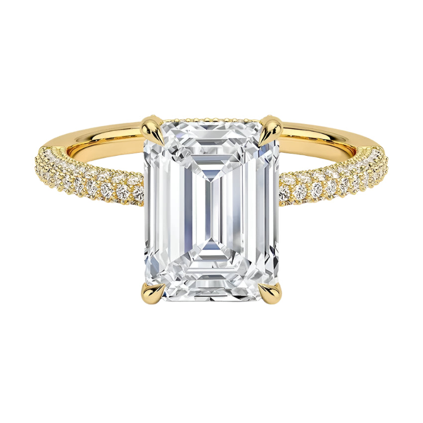 Emerald cut Moissanite lab grown diamond engagement ring with three row micro pave set gold shank, hidden halo and moissanite encrusted claws against a white background.Moissanite engagement ring cape town south africa grand diamonds ralph jacobs jeulia 