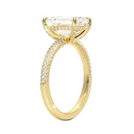 Emerald cut Moissanite lab grown diamond engagement ring with three row micro pave set gold shank, hidden halo and moissanite encrusted claws against a white background.Moissanite engagement ring cape town south africa grand diamonds ralph jacobs jeulia 