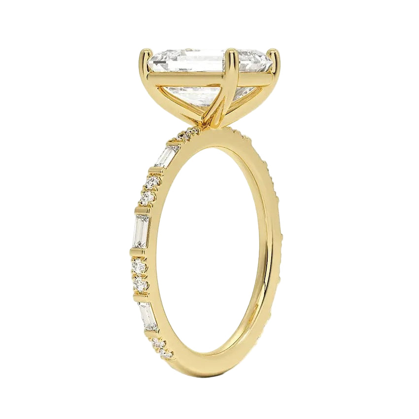 Emerald cut Moissanite lab grown diamond engagement ring with fancy baguette and round cut moissanite set pave gold band, against a white background.Moissanite engagement ring cape town south africa grand diamonds ralph jacobs jeulia 