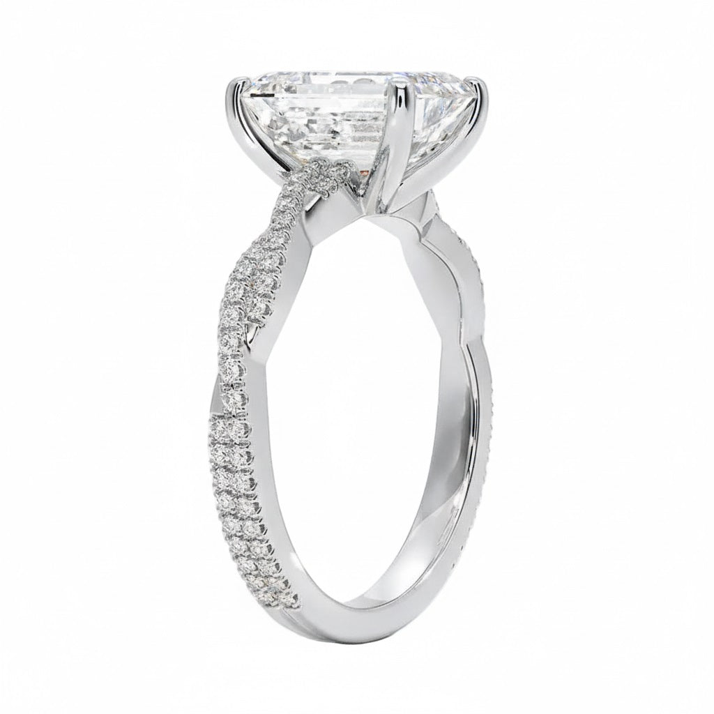 Emerald cut Moissanite lab grown diamond engagement ring with twisted pave set gold shank, against a white background.Moissanite engagement ring cape town south africa grand diamonds ralph jacobs jeulia 