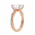 Emerald cut Moissanite lab grown diamond engagement ring with twisted single pave set gold shank, against a white background.Moissanite engagement ring cape town south africa grand diamonds ralph jacobs jeulia