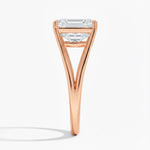 Emerald cut Moissanite lab grown diamond engagement ring round shank with a four claw setting, on a gold band, against a white background.Moissanite engagement ring cape town south africa grand diamonds ralph jacobs jeulia 