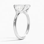 Emerald  cut Moissanite lab grown diamond engagement ring V-split band  with a four claw setting, on a gold band, against a white background.Moissanite engagement ring cape town south africa grand diamonds ralph jacobs jeulia  