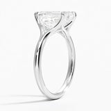 Emerald  cut Moissanite lab grown diamond engagement ring V-split band  with a four claw setting, on a gold band, against a white background.Moissanite engagement ring cape town south africa grand diamonds ralph jacobs jeulia  