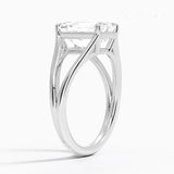 Emerald cut Moissanite lab grown diamond engagement ring round shank with a four claw setting, on a gold band, against a white background.Moissanite engagement ring cape town south africa grand diamonds ralph jacobs jeulia 