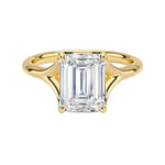 Emerald  cut Moissanite lab grown diamond engagement ring V-split band  with a four claw setting, on a gold band, against a white background.Moissanite engagement ring cape town south africa grand diamonds ralph jacobs jeulia  