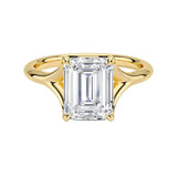 Emerald  cut Moissanite lab grown diamond engagement ring V-split band  with a four claw setting, on a gold band, against a white background.Moissanite engagement ring cape town south africa grand diamonds ralph jacobs jeulia  