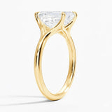 Emerald  cut Moissanite lab grown diamond engagement ring V-split band  with a four claw setting, on a gold band, against a white background.Moissanite engagement ring cape town south africa grand diamonds ralph jacobs jeulia  