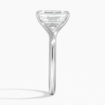 Emerald  cut Moissanite lab grown diamond engagement ring V-split band  with a four claw setting, on a gold band, against a white background.Moissanite engagement ring cape town south africa grand diamonds ralph jacobs jeulia  