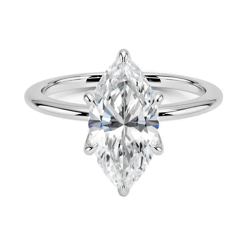 Marquise cut Moissanite lab grown diamond engagement ring round shank with six cat claw setting, on a gold band, against a white background.Moissanite engagement ring cape town south africa grand diamonds ralph jacobs jeulia