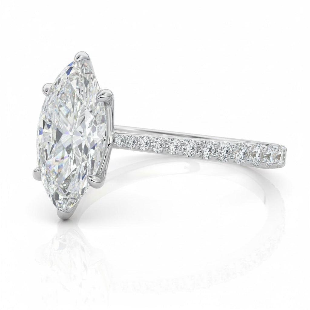 Marquise cut Moissanite lab grown diamond engagement ring pave set shank with cathedral setting, on a gold band, against a white background.Moissanite engagement ring cape town south africa grand diamonds ralph jacobs jeulia