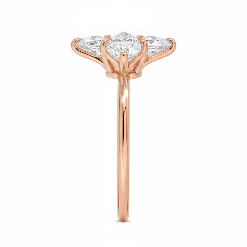 Marquise cut Moissanite lab grown diamond engagement ring round shank with six cat claw setting, on a gold band, against a white background.Moissanite engagement ring cape town south africa grand diamonds ralph jacobs jeulia