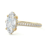 Marquise cut Moissanite lab grown diamond engagement ring with three row micro pave set gold shank, hidden double halo four cat claw against a white background.Moissanite engagement ring cape town south africa grand diamonds ralph jacobs jeulia 