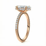 Marquise cut Moissanite lab grown diamond engagement ring round shank with four cat claw setting hidden halo and pave set shank, on a gold band, against a white background.Moissanite engagement ring cape town south africa grand diamonds ralph jacobs jeulia 