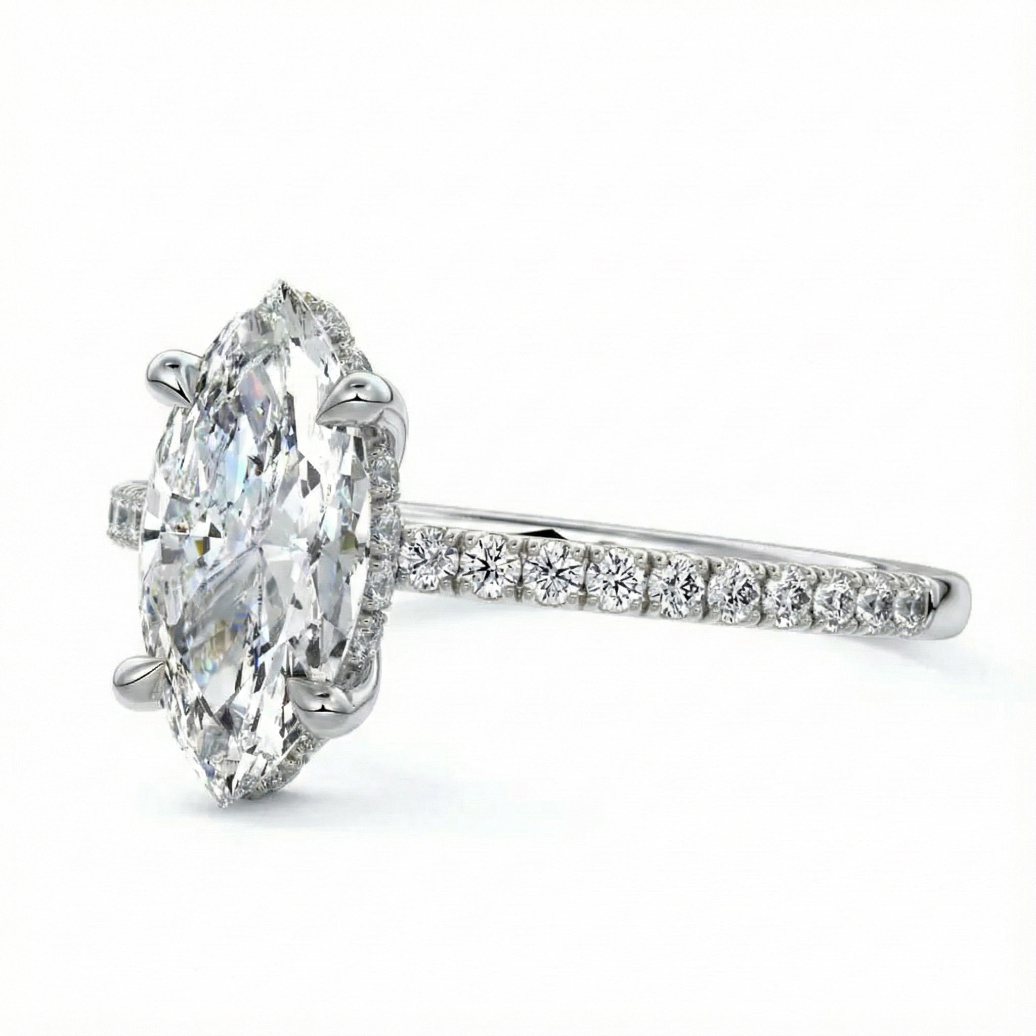 Marquise cut Moissanite lab grown diamond engagement ring round shank with four cat claw setting hidden halo and pave set shank, on a gold band, against a white background.Moissanite engagement ring cape town south africa grand diamonds ralph jacobs jeulia 