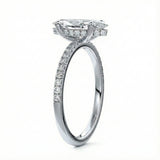 Marquise cut Moissanite lab grown diamond engagement ring round shank with four cat claw setting hidden halo and pave set shank, on a gold band, against a white background.Moissanite engagement ring cape town south africa grand diamonds ralph jacobs jeulia 