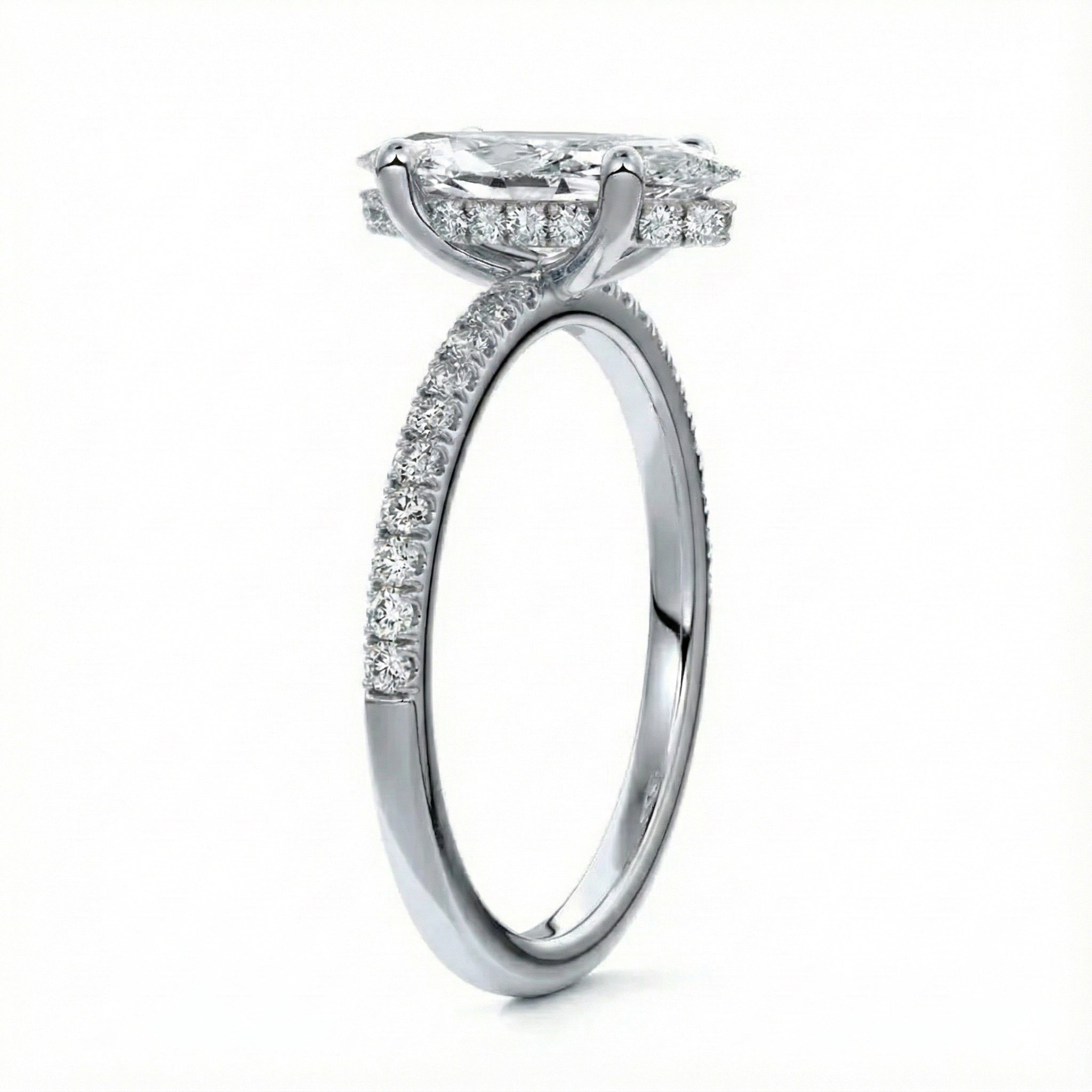 Marquise cut Moissanite lab grown diamond engagement ring round shank with four cat claw setting hidden halo and pave set shank, on a gold band, against a white background.Moissanite engagement ring cape town south africa grand diamonds ralph jacobs jeulia 