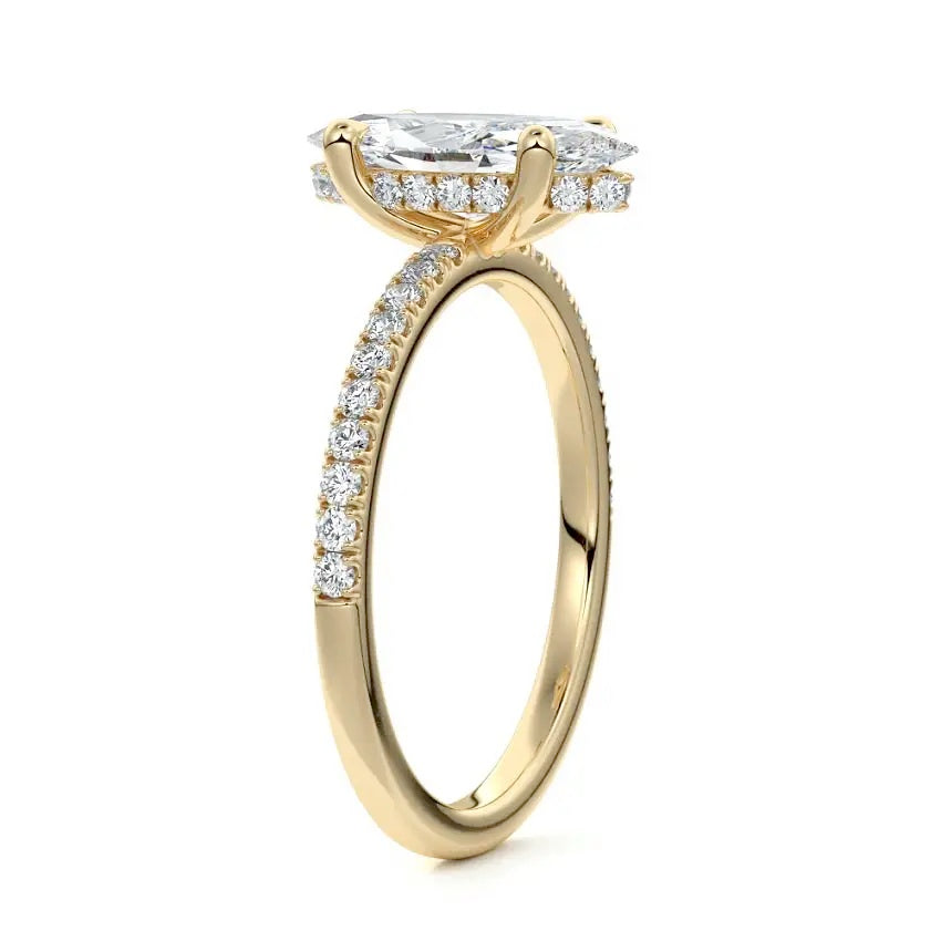 Marquise cut Moissanite lab grown diamond engagement ring round shank with four cat claw setting hidden halo and pave set shank, on a gold band, against a white background.Moissanite engagement ring cape town south africa grand diamonds ralph jacobs jeulia 