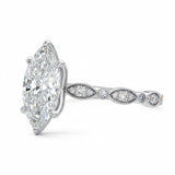 Marquise cut Moissanite lab grown diamond engagement ring half eternity fancy set shank with classic six prong setting, on a gold band, against a white background.Moissanite engagement ring cape town south africa grand diamonds ralph jacobs jeulia 