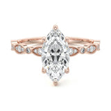 Marquise cut Moissanite lab grown diamond engagement ring half eternity fancy set shank with classic six prong setting, on a gold band, against a white background.Moissanite engagement ring cape town south africa grand diamonds ralph jacobs jeulia 