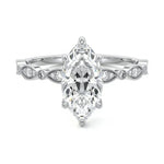 Marquise cut Moissanite lab grown diamond engagement ring half eternity fancy set shank with classic six prong setting, on a gold band, against a white background.Moissanite engagement ring cape town south africa grand diamonds ralph jacobs jeulia 