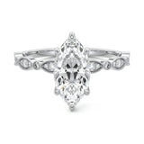 Marquise cut Moissanite lab grown diamond engagement ring half eternity fancy set shank with classic six prong setting, on a gold band, against a white background.Moissanite engagement ring cape town south africa grand diamonds ralph jacobs jeulia 