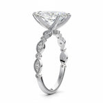 Marquise cut Moissanite lab grown diamond engagement ring half eternity fancy set shank with classic six prong setting, on a gold band, against a white background.Moissanite engagement ring cape town south africa grand diamonds ralph jacobs jeulia 