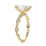 Marquise cut Moissanite lab grown diamond engagement ring half eternity fancy set shank with classic six prong setting, on a gold band, against a white background.Moissanite engagement ring cape town south africa grand diamonds ralph jacobs jeulia 