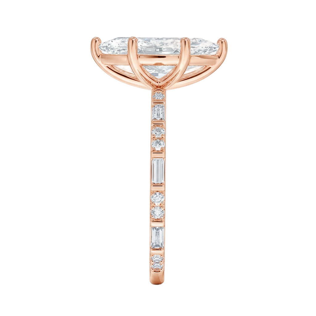 Marquise cut Moissanite lab grown diamond engagement ring with baguette and round moissanite's pave set shank with classic four prong setting, on a gold band, against a white background.Moissanite engagement ring cape town south africa grand diamonds ralph jacobs jeulia 