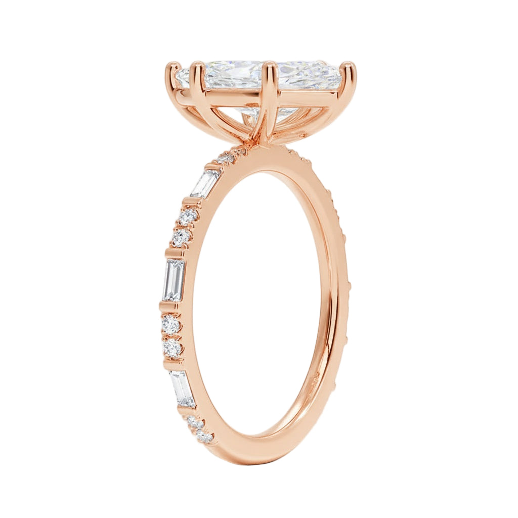 Marquise cut Moissanite lab grown diamond engagement ring with baguette and round moissanite's pave set shank with classic four prong setting, on a gold band, against a white background.Moissanite engagement ring cape town south africa grand diamonds ralph jacobs jeulia 