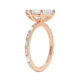 Marquise cut Moissanite lab grown diamond engagement ring with baguette and round moissanite's pave set shank with classic four prong setting, on a gold band, against a white background.Moissanite engagement ring cape town south africa grand diamonds ralph jacobs jeulia 