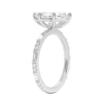 Marquise cut Moissanite lab grown diamond engagement ring with baguette and round moissanite's pave set shank with classic four prong setting, on a gold band, against a white background.Moissanite engagement ring cape town south africa grand diamonds ralph jacobs jeulia 