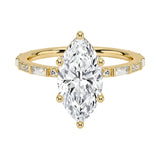 Marquise cut Moissanite lab grown diamond engagement ring with baguette and round moissanite's pave set shank with classic four prong setting, on a gold band, against a white background.Moissanite engagement ring cape town south africa grand diamonds ralph jacobs jeulia 