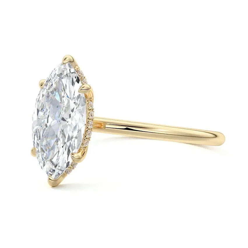 Engagement ring with marquise cut moissanite or lab grown diamond solitaire six claw  hidden halo setting yellow rose or white gold hidden halo and pave set shank Cape Town South Africa grand diamonds ralph jacobs jeuli