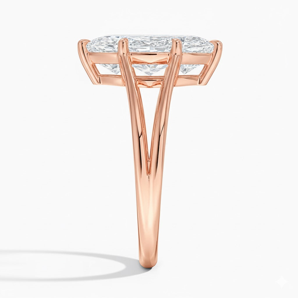 Marquise cut Moissanite lab grown diamond engagement ring V-Split shank with six cat claw setting, on a gold band, against a white background.Moissanite engagement ring cape town south africa grand diamonds ralph jacobs jeulia