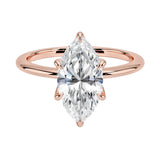 Marquise cut Moissanite lab grown diamond engagement ring round shank with six cat claw setting, on a gold band, against a white background.Moissanite engagement ring cape town south africa grand diamonds ralph jacobs jeulia