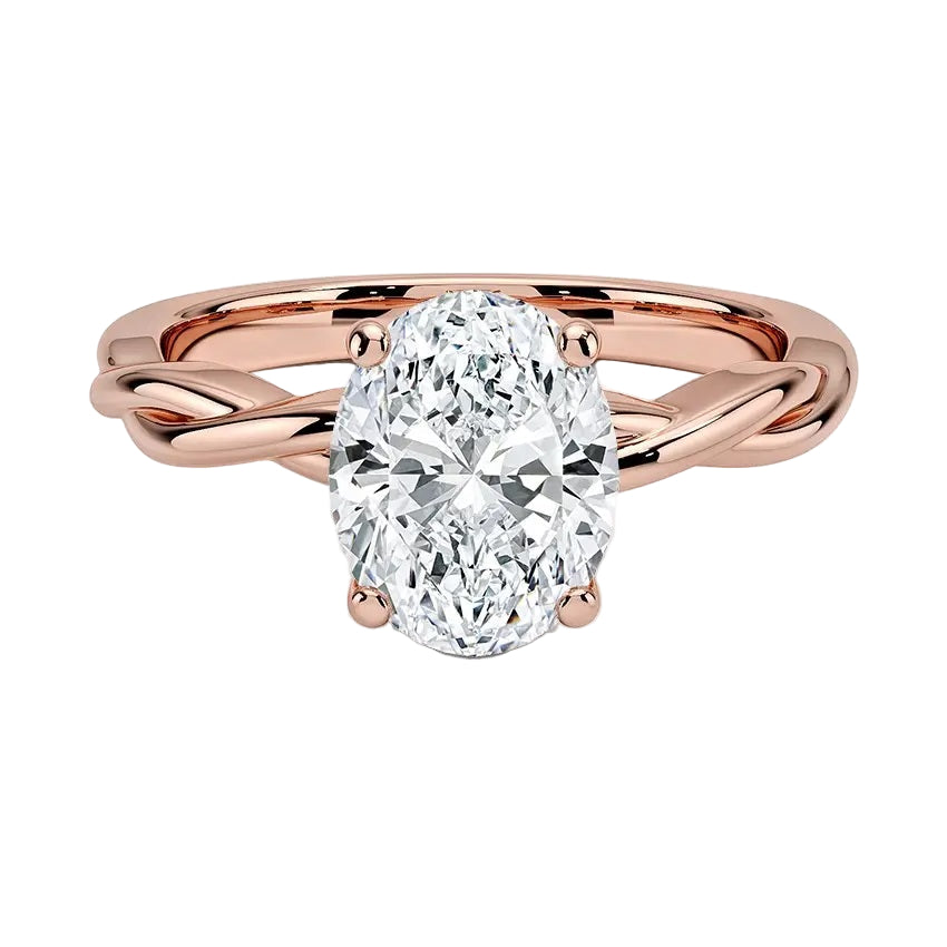 Oval cut Moissanite lab grown diamond engagement ring braided shank with a four claw setting, on a gold band, against a white background.Moissanite engagement ring cape town south africa grand diamonds ralph jacobs jeulia 
