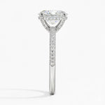 Oval cut Moissanite lab grown diamond engagement ring with three row micro pave set gold shank, hidden halo and encrusted claws against a white background.Moissanite engagement ring cape town south africa grand diamonds ralph jacobs jeulia 