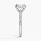 Oval cut Moissanite lab grown diamond engagement ring with three row micro pave set gold shank, hidden halo and encrusted claws against a white background.Moissanite engagement ring cape town south africa grand diamonds ralph jacobs jeulia 