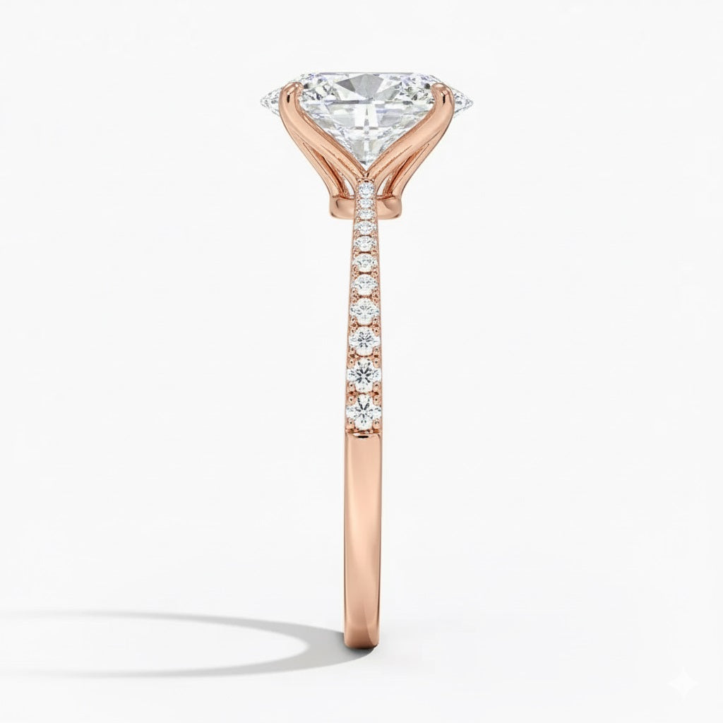 Oval cut Moissanite lab grown diamond engagement ring with tapered pave set shank on a gold band, against a white background.Moissanite engagement ring cape town south africa grand diamonds ralph jacobs jeulia 