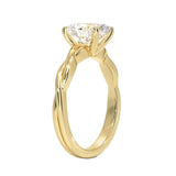 Oval cut Moissanite lab grown diamond engagement ring braided shank with a four claw setting, on a gold band, against a white background.Moissanite engagement ring cape town south africa grand diamonds ralph jacobs jeulia 