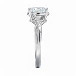 Oval cut Moissanite lab grown diamond engagement ring twisted v shank set with shared prong stones on a gold shank, against a white background.Moissanite engagement ring cape town south africa grand diamonds ralph jacobs jeulia 