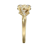 Oval cut Moissanite lab grown diamond engagement ring twisted v shank set with shared prong stones on a gold shank, against a white background.Moissanite engagement ring cape town south africa grand diamonds ralph jacobs jeulia 